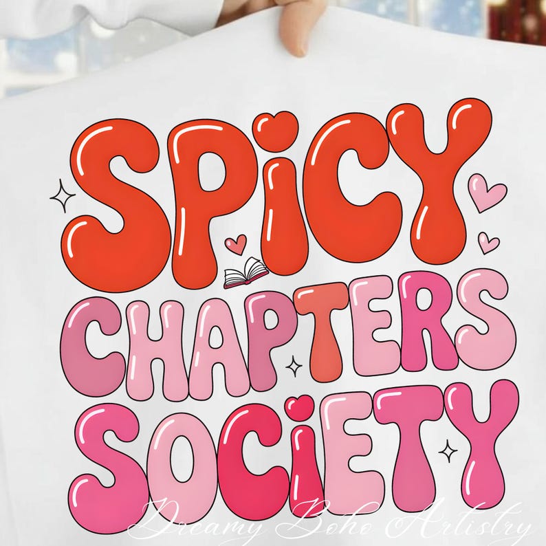 May include: White t-shirt featuring the text "SPICY CHAPTERS SOCIETY" in a retro bubble font. The design uses shades of red and pink, with heart and star motifs. The overall style is reminiscent of vintage graphics.