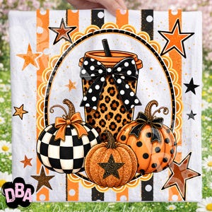 May include: A square fabric panel featuring a central oval frame with a leopard print coffee cup adorned with a black and white polka dot bow. Three pumpkins are below, one checkered, one orange with black dots, and one glittery orange with a star.