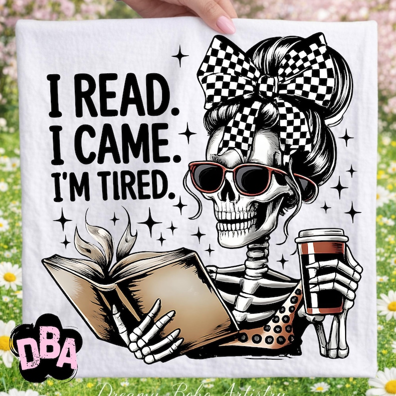 May include: White decorative towel with a skeleton graphic wearing sunglasses and a checkered bow, holding a book and a coffee cup. The text reads "I READ. I CAME. I'M TIRED."