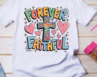 May include: White t-shirt with a colorful graphic design that says "Forever Faithful" with a cross and hearts.