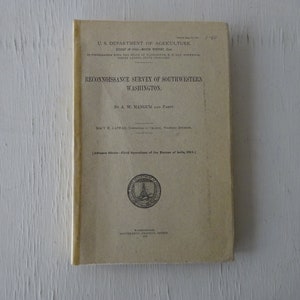 May include: A vintage book cover with the title "RECONNOISSANCE SURVEY OF SOUTHWESTERN WASHINGTON" by A. W. Mangum and Party. The cover is beige with black text and a seal of the U.S. Department of Agriculture.