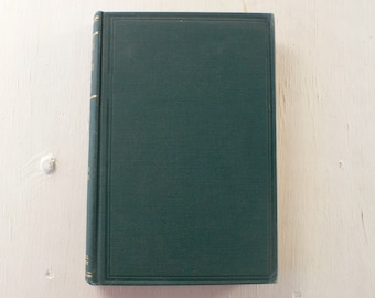 May include: A dark green hardcover book with gold accents on the spine and edges.