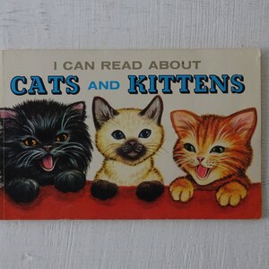 May include: A vintage children's book cover with the title "I Can Read About Cats and Kittens". The cover features three kittens: a black kitten, a Siamese kitten, and a tabby kitten. The kittens are all smiling and looking at the viewer.