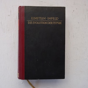 May include: A black hardcover book with a red spine. The title on the cover reads "EINSTEIN - INFELD DIE EVOLUTION DER PHYSIK".