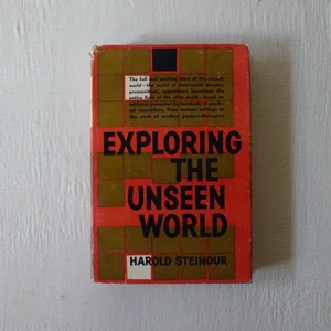 May include: A red book with a gold cover and the title "Exploring the Unseen World" by Harold Steinour. The book cover features a grid pattern.