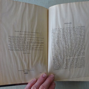 May include: An open book with a preface page titled "Preface". The page discusses the changes made to the book's format and the benefits of the new format for students. The copyright information for the book is on the left page.