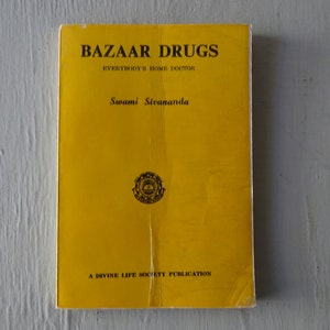 May include: A yellow book titled "Bazaar Drugs: Everybody's Home Doctor" by Swami Sivananda. The book is a Divine Life Society Publication.