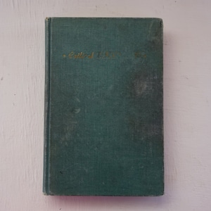 May include: A green hardcover book with the title "Critical Theory" written in gold lettering on the front cover.