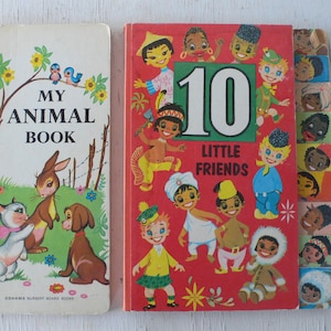 May include: Two vintage children's board books. The book on the left is titled "My Animal Book" and features illustrations of a cat, rabbit, and dog. The book on the right is titled "10 Little Friends" and features a large number 10 with illustrations of children from different cultures.