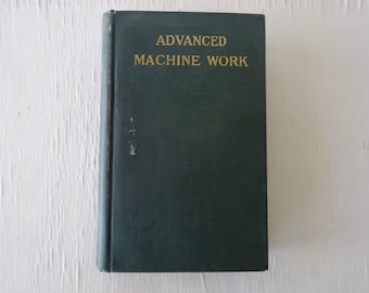May include: A dark green hardcover book with the title "ADVANCED MACHINE WORK" in gold lettering.