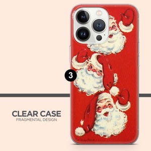 May include: A clear phone case featuring a vibrant red background with three repeating illustrations of Santa Claus. Each Santa has a white beard, a red hat, and a cheerful expression. The case has a cutout for a triple-lens camera system.