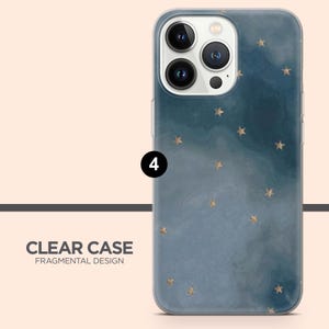 May include: Clear phone case with a blue watercolor background and gold star pattern. The case has the text "CLEAR CASE FRAGMENTAL DESIGN". The case is designed to fit a smartphone.