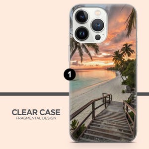 May include: Clear phone case with a tropical beach scene, a wooden walkway, and a sunset sky. The case features palm trees and the text "CLEAR CASE FRAGMENTAL DESIGN".