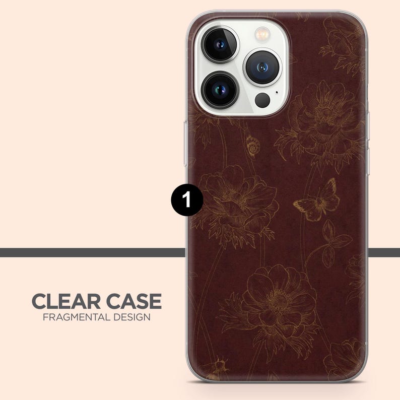 May include: Clear phone case with a brown floral design. The case features a detailed pattern of flowers and butterflies in a gold color. The text "CLEAR CASE FRAGMENTAL DESIGN" is printed at the bottom.