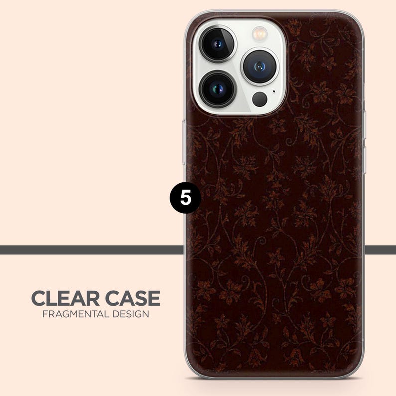 May include: A clear phone case with a dark brown floral pattern. The case has a clear border and the text "CLEAR CASE FRAGMENTAL DESIGN" is visible at the bottom. The phone case is designed to fit a smartphone.