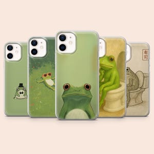 May include: A collection of five phone cases with various frog illustrations. The designs include a frog wearing a top hat, a frog in sunglasses, and a frog sitting on a toilet. The cases are in shades of green.