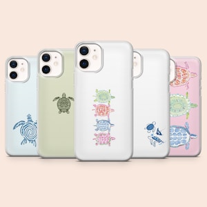 May include: A collection of five phone cases, each featuring a unique turtle design. The cases vary in color, including light blue, green, white, and pink. The turtle designs are in various colors and styles, adding a touch of marine life to the accessories.