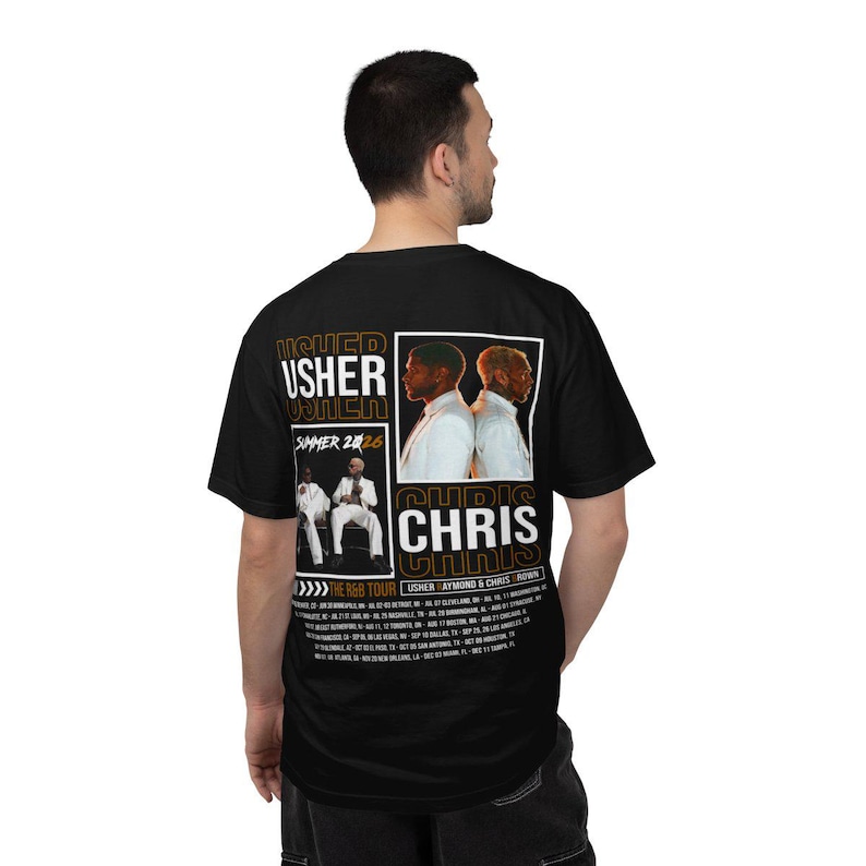 May include: A black short-sleeve t-shirt featuring a graphic print on the back. The design includes the text USHER and CHRIS, images of two performers, the text SUMMER 2026, and a list of tour dates for THE R&B TOUR USHER RAYMOND & CHRIS BROWN.