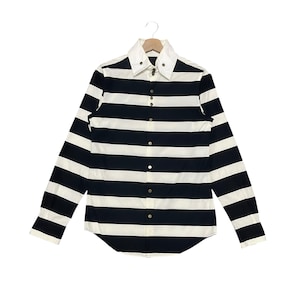 May include: A long-sleeve button-down shirt featuring horizontal black and white stripes. The shirt has a solid white pointed collar with two small metal buttons at the tips and a front placket with silver-toned metal buttons down the center.