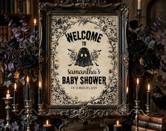 May include: A framed sign with the text "Welcome to Samantha's Baby Shower" and a ghost illustration. The sign is in a dark, ornate frame, surrounded by candles, black roses, and other gothic-themed decorations. The date is October 20, 2025.