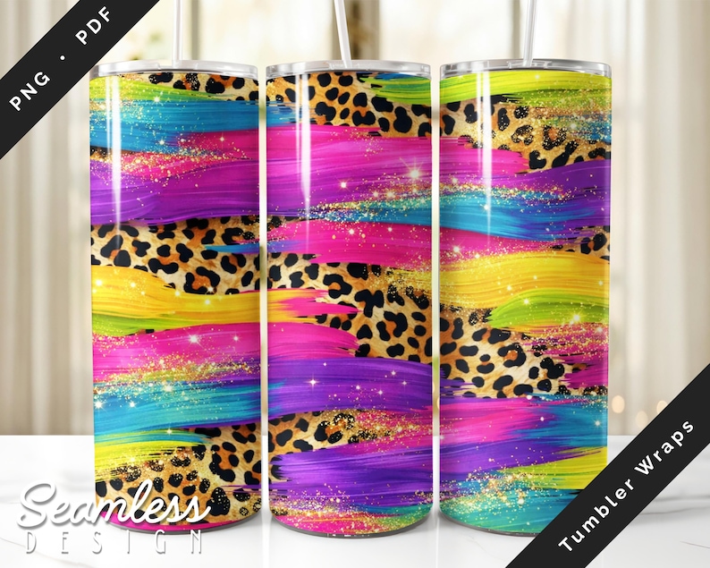 Seamless 20oz skinny tumbler wrap mockup featuring bold neon brush stroke stripes in pink, purple, teal, yellow, and green layered over leopard print with gold glitter sparkles, displayed on three stainless steel tumblers, PNG and PDF sublimation design for straight and tapered wraps.