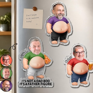 May include: A set of three personalized fridge magnets featuring cartoon figures with faces. One holds pizza, another a beer, and the third has no props. The text "IT'S NOT A DAD BOD IT'S A FATHER FIGURE" is visible on one magnet.