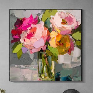 May include: A framed floral painting featuring a bouquet of colorful flowers in a clear glass vase. The flowers are painted in shades of pink, yellow, and red with green leaves. The background is a mix of gray and white brushstrokes.