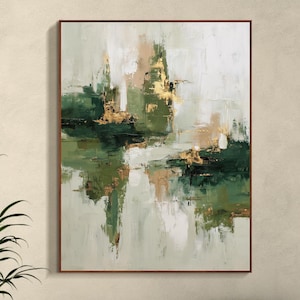 May include: Abstract art painting in a brown frame. The artwork features a blend of green, gold, and white brushstrokes, creating a textured effect. The painting has a modern, minimalist style, suitable for home decor.