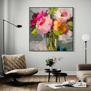 May include: A framed floral painting featuring a bouquet of colorful flowers in a glass vase. The flowers are painted with thick brushstrokes in shades of pink, orange, and yellow, with green leaves. The artwork is displayed in a modern living room setting.