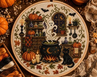 May include: A circular embroidery hoop containing a cross-stitch pattern of a Halloween scene. The design features a black cauldron with a crescent moon, a white ghost, a black cat, pumpkins, candles, potion bottles, and a window with a crescent moon.