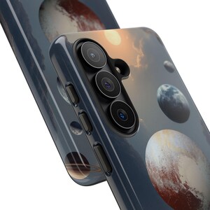 May include: A smartphone case featuring a celestial design with planets, moons, and a sun against a dark blue sky. The case has a glossy finish and a camera module with three lenses.