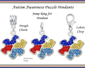 May include: Autism Awareness puzzle pendants with a silver finish. Each pendant is a jigsaw puzzle piece with red, blue, and yellow crystal accents. Includes a dangle charm, jump ring, and lobster clasp. The pendants measure 20mm x 24.6mm and weigh 3.65g.