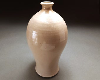 Tall white decorative wood and salt fired bottle with pale green ash drip