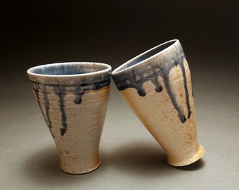 Pair of small wood fired ice cream cups with runny blue glaze