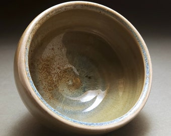 Beautiful one of a kind orange wood fired bowl with blue celadon glaze and brown microcrystals