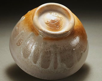 Gray and orange wood fired soup bowl with glossy glaze drips
