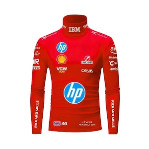 May include: A bright red long-sleeve mock neck shirt featuring various white and blue sponsor logos including HP, Shell, IBM, and UniCredit. The front displays the number 44, a British flag, and the name Lewis Hamilton printed in white text.