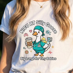 May include: White t-shirt featuring a cartoon goose in a teal medical uniform, holding a coffee cup and a baby. Text includes "NICU RT Silly Goose" and "Big Lungs for Tiny Babies". The design has hearts, oxygen symbols, and a heartbeat line.
