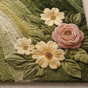 May include: A detailed close-up of a green rug with a floral design. The rug features three yellow daisies, a pink rose, and green leaves. The background has a gradient of green shades.