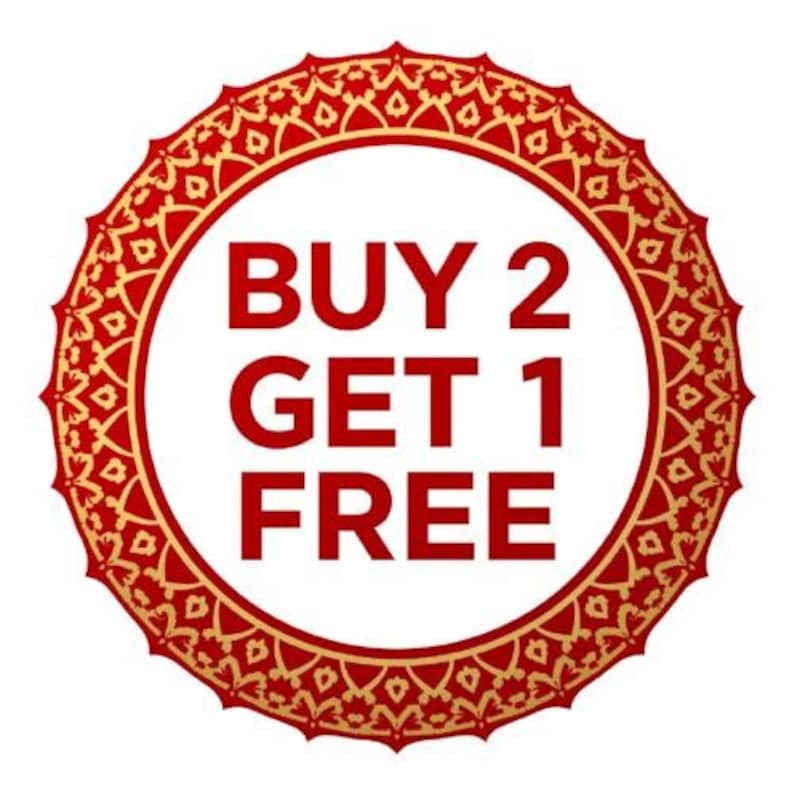 May include: A circular red and gold design with the text "BUY 2 GET 1 FREE" in bold red letters. The design has an ornate, patterned border and a white interior.