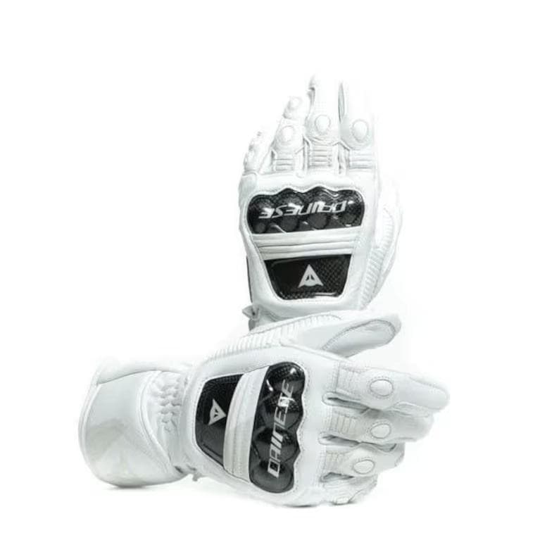 May include: White motorcycle gloves with black accents. The gloves feature protective panels on the knuckles and wrist, with the brand name "DAINESE" visible. The gloves are designed for motorcycle riding and offer protection and grip.
