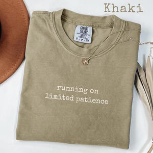 May include: A set of three ceramic mugs with a speckled, matte finish in cream, light grey, and dark grey. Each mug has a simple, minimalist design and a rounded handle.
