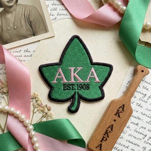 May include: A rustic wooden sign with the text "Welcome to our home" in a handwritten style. The sign features a distressed finish and a simple, inviting design, perfect for entryway decor.