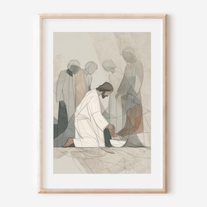以下が含まれることがあります： 宗教的なシーンを描いた額入りのアートプリント。アートワークは、ひざまずいて他の人の足を洗う人物と、背景に他のいくつかの人物を描いています。スタイルは、落ち着いた色調と線画を用いたミニマリストです。