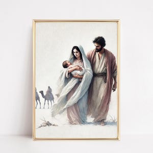 Puede incluir: Pintura a la acuarela enmarcada en oro que representa a una familia. Una mujer con un velo blanco sostiene a un bebé, mientras un hombre con una túnica camina junto a ellos. Camellos en el fondo, sugiriendo una escena desértica.
