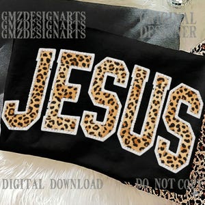 May include: Black fabric with the word "JESUS" in large, leopard print letters outlined in white. The image also includes the text "DIGITAL DOWNLOAD" and "DO NOT COPY".
