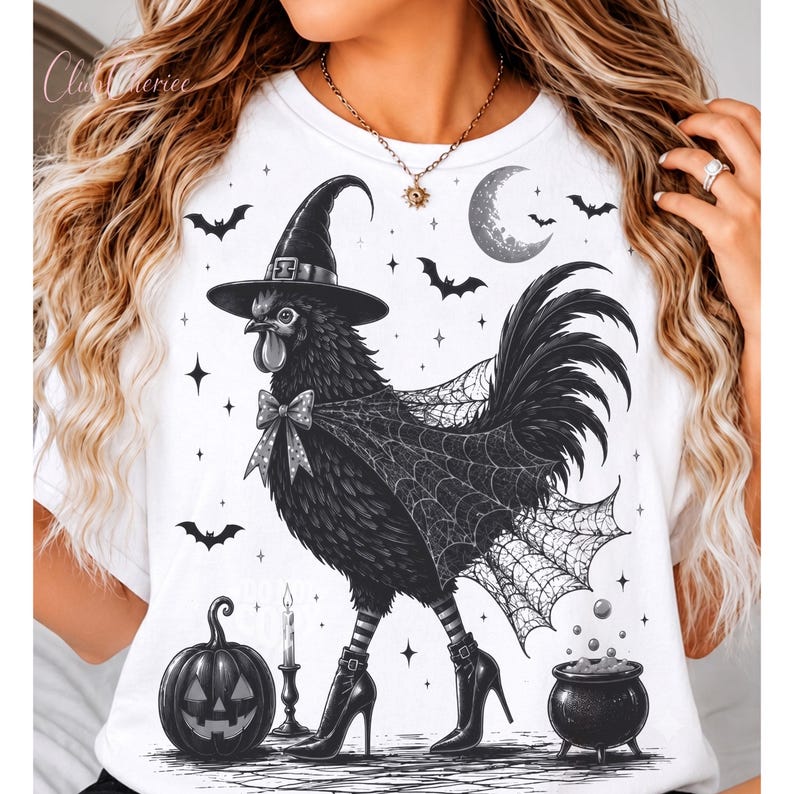 May include: A white t-shirt featuring a graphic of a black chicken wearing a witch hat, a spiderweb cape, and high-heeled boots. The design includes a jack-o'-lantern, a lit candle, a bubbling cauldron, bats, and a crescent moon in the background.