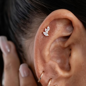 May include: A rustic wooden sign with the words "Welcome to our home" in white lettering. The sign has a distressed finish and a simple, inviting design, ideal for front door decor.