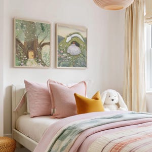 May include: A child's bedroom with two framed art prints above a bed. The bed has pink pillows, a yellow pillow, and a white stuffed bunny. The bedding is pink and striped. The room has striped curtains and a light fixture.