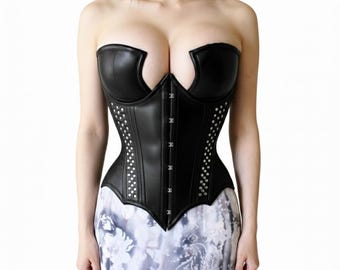 May include: A black leather corset with a strapless design. The corset features silver-colored studs along the sides and a series of metal clasps down the front. The garment has a structured, form-fitting silhouette.